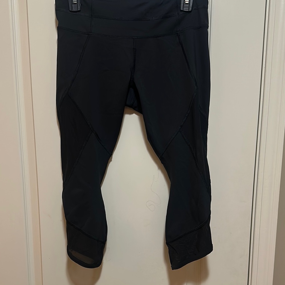Athleta Petite Medium cropped leggings with mesh inlay